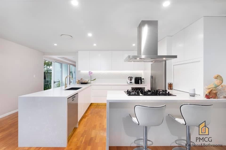 Luxury dark cabinetry kitchen with marble benchtop — Warriewood
