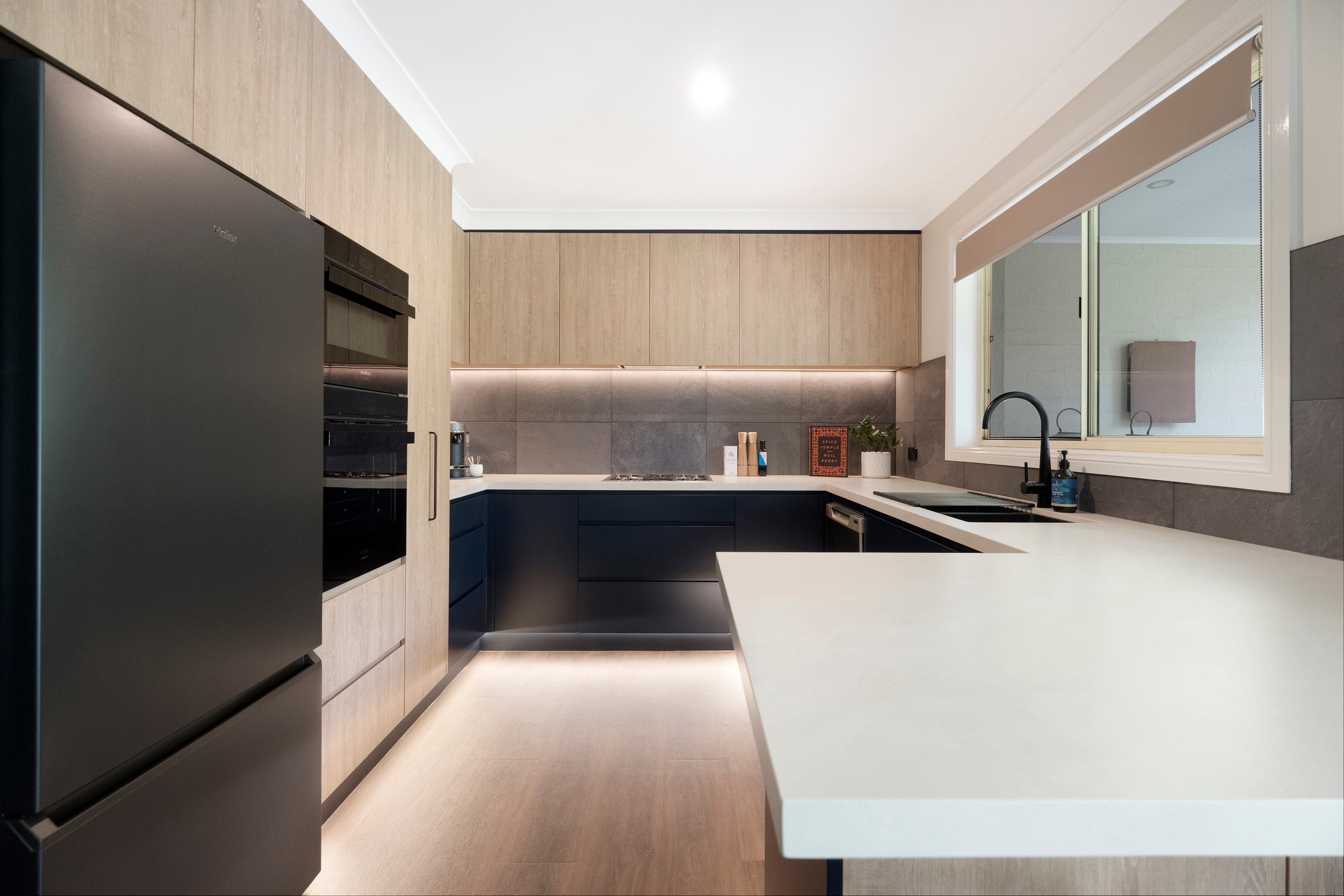 Custom kitchen renovation with timber cabinetry and stone island — Bella Vista
